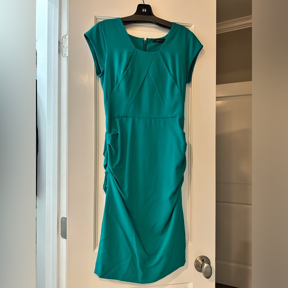 BCBG teel dress. Size 2. Ruching hugs to slim you.